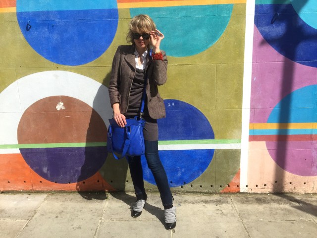 Lettie in Notting Hill Gate in her grandmother's moth ridden coat with her purchases taken by Raj Curry April 2015